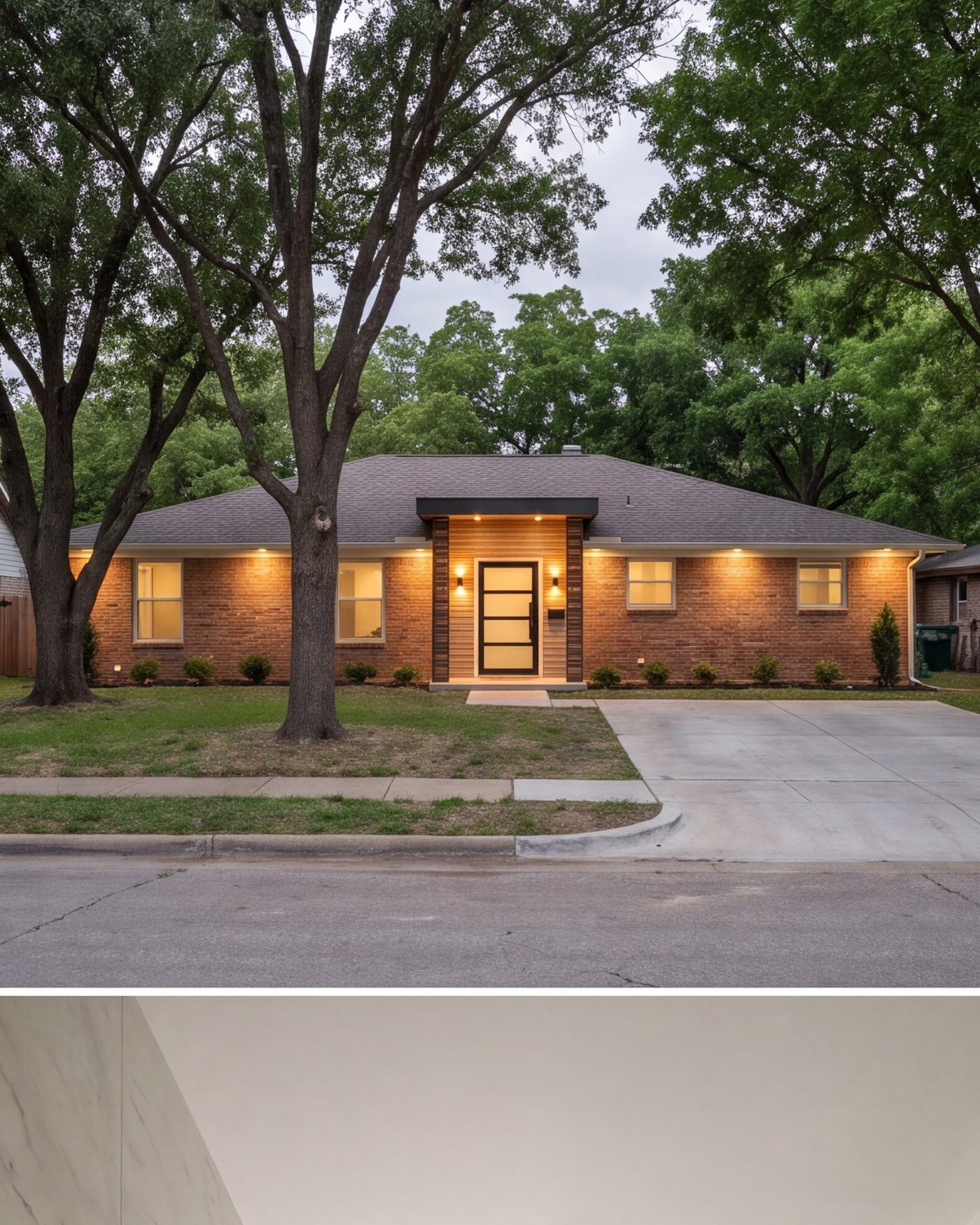 front of a remodeled single-story North Dallas brick home, new entry, mature trees, evening