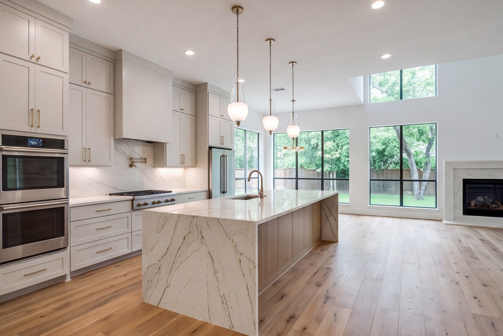 Coppell two-story home with a waterfall stone island open to the family room